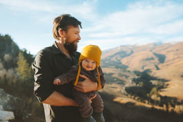 Father walking with baby daughter in mountains travel family adventure lifestyle vacations dad with...
