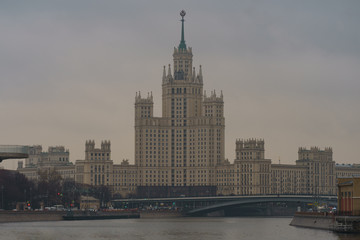 Obraz premium Photography of Stalinist skyscraper on Kotelnicheskaya embankment and Observation Deck Zaryadye Park at autumn day. International touristic concepts.