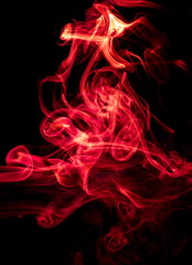 Red smoke on black background