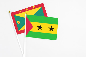 Sao Tome And Principe and Grenada stick flags on white background. High quality fabric, miniature...