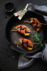 Bacon wrapped baked persimmons with rosemary 
