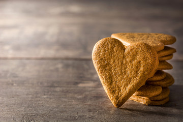 Heart shaped cookie on wooden table with copy space. Valentine's Day and Mother's Day concept.	