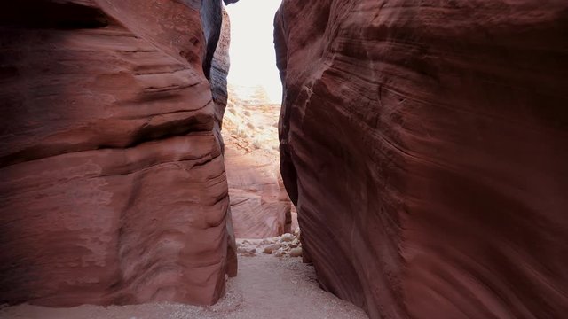 Movement In Slot Canyon With Wavy And Smooth Sandstone Walls Bright Orange