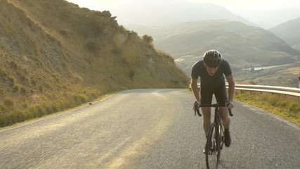 Male cycling road bike The Remarkables New Zealand - Powered by Adobe