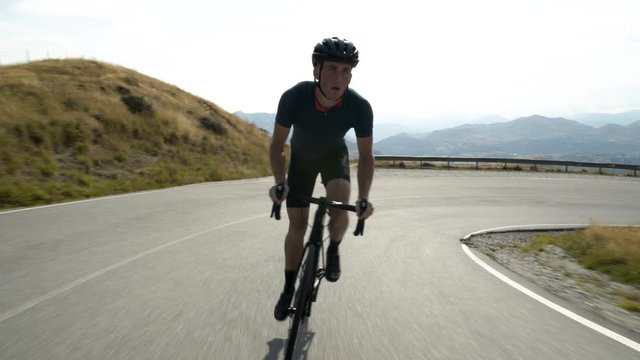 Male cyclist riding bike Lake Wakatipu New Zealand