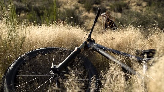 Male dirt bike rider building jump ramp Otago