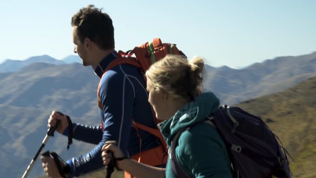 Adventure couple spending vacation hiking outdoors The Remarkables
