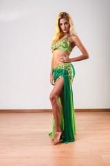 Young blonde belly dancer looking at the camera