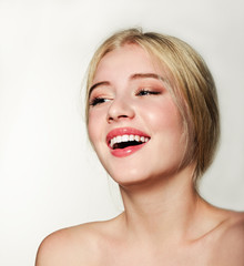 Portrait of laughing beautiful blonde young woman face.  Spa model girl with fresh clean skin...