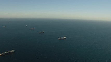 Aerial sunset view super tankers anchored offshore Perth