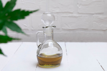 CBD cannabis oil in a jar on white table