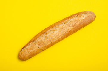 Bread baguette bakery on yellow background, top view