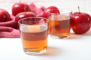 apple juice from red apples on the table.