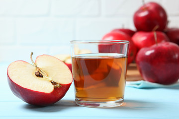 apple juice from red apples on the table.