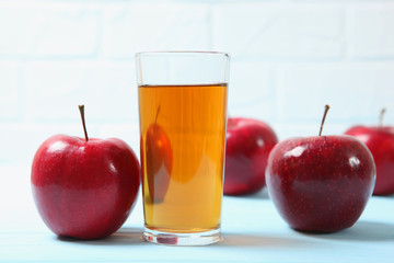 apple juice from red apples on the table.