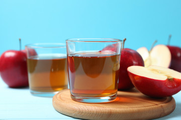 apple juice from red apples on the table.