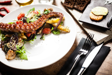 Octopus salad served on a plate in restaurant