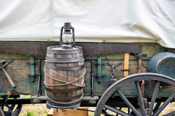 Rain Barrel and Lantern on Covered Wagon