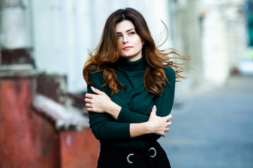 Fototapeta premium Beauty portrait of female face with natural skin. Beauty portrait of female face. Gorgeous young model woman posing in the city. Wonderful white female. Stylish girl. Hipster. Russian.