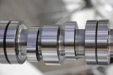 Cams on new car engine camshaft close up