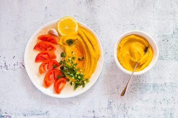 Yellow pumpkin puree with fresh vegetables.