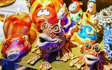 Ceramic souvenirs at stall during the Christmas market in winter Riga in Latvia. Europe in winter. German street Xmas and holiday fair. Advent Decoration and Stalls with Crafts Items on Bazaar