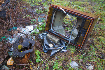 Old, broken TV on the ground