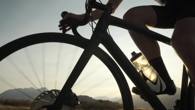 Male cyclist bike ride at sunrise New Zealand