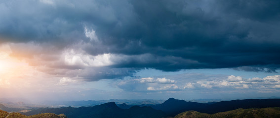 Overcast sky and cloud at the mountain range in the background