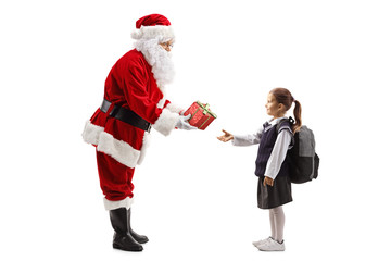 Santa Claus giving a sparkly red present box to a schoolgirl
