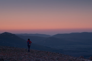 hiking in the mountains at sunset