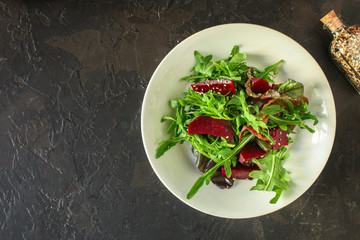 salad beetroot and leaf mix (lettuce, arugula, red chard and more) menu concept. food background. top view. copy space