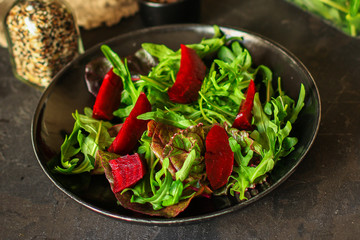 salad beetroot and leaf mix (lettuce, arugula, red chard and more) menu concept. food background. top view. copy space