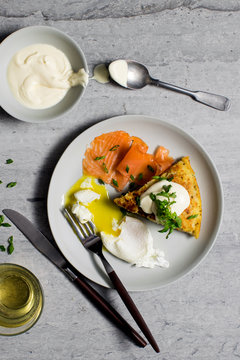 Overhead view of Swiss rosti with smoked salmon and poached egg
