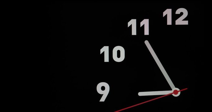 Timelapse or time lapse of clock on black background and movement of clock hands. Royalty high-quality 4k stock video footage time lapse clock with three arrow white hands moving too fast to 9 oclock