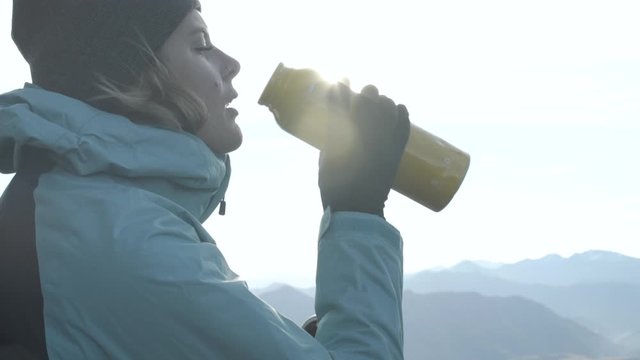 Female adventure hiker drinking water outdoor New Zealand