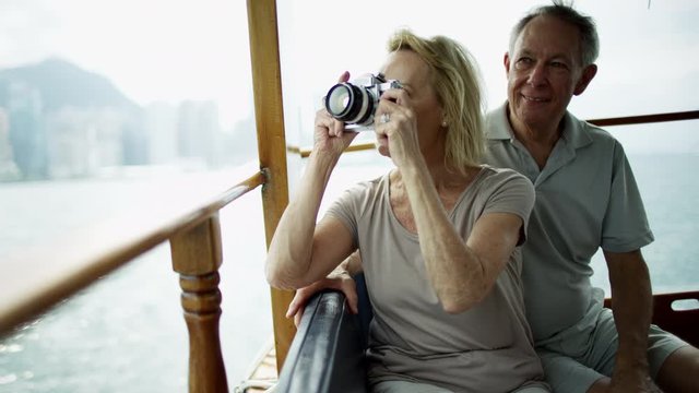 Senior Caucasian couple picture taking Hong Kong Asia