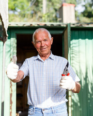 Satisfied senior man in his homestead