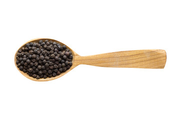black pepper grains in wooden spoon isolated on white background. spice for cooking food, top view.