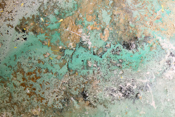 Acrylic artwork with golden, turquoise and grey stains. Abstract modern art on canvas. Grunge effect.