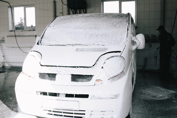 White car at the sink in the foam