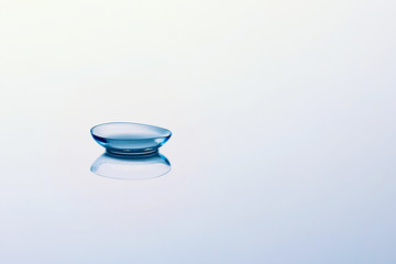 Contact lenses on light blue background. Eyewear, eyesight, eye care and health, ophthalmology and...