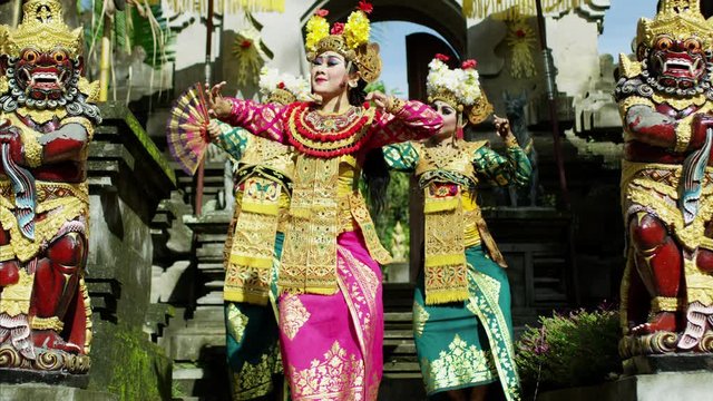 Colorful Balinese females dancing Hindu temple Indonesia Asia