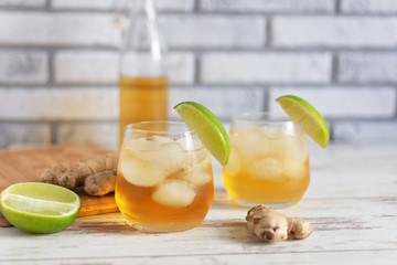 Fresh Ginger Ale with lime and ice or Kombucha in Bottle - Homemade lemon and ginger organic...