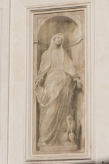 Painting at the left side of the entrance of the Santa Maria della Carita church, Brescia, Lombardy, Italy.