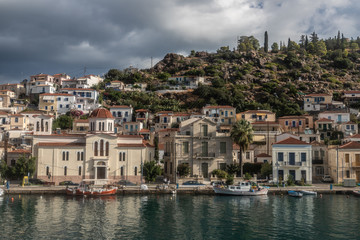 Fototapeta na wymiar Boats and houses in a village in Poros Island