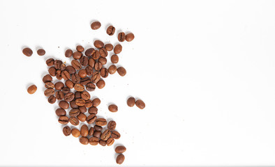 not ground coffee beans sprinkled on a white background