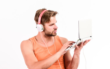 web blog. relax playlist. sexy muscular man listen music from playlist. man relax in earphones...