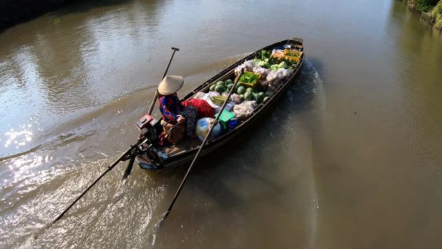 Female selling fresh produce Mekong river South Vietnam