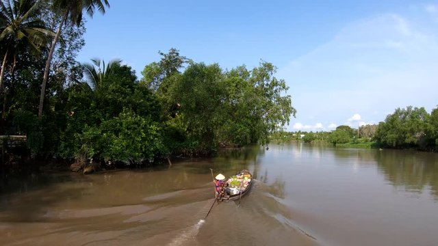 Mekong Delta tributary floating market river vendors Vietnam